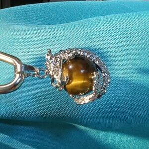 Dragon pendant with tiger eye mineral
